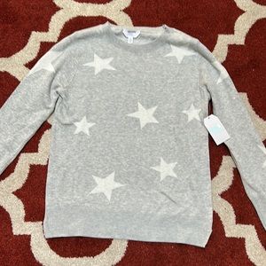 Brand new star sweater sized small!